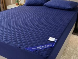 Cotton , water proof and can fit upto 9.5 inch mattress.